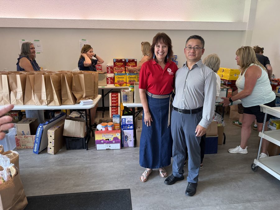 Volunteers sorting donated food and supplies for families