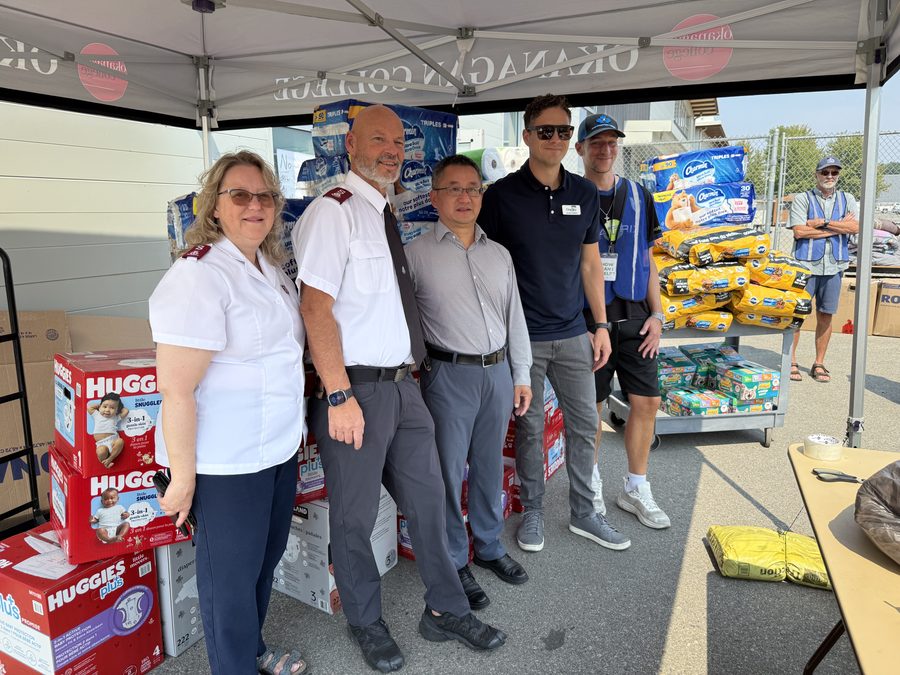With relief partners and volunteers at the Okanagan College donation hub